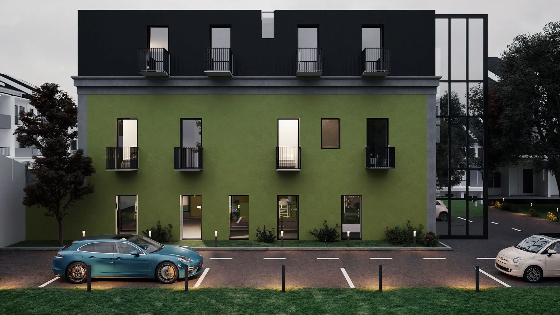 Habitação multifamiliar de fachada verde e escura, ao fim do dia
